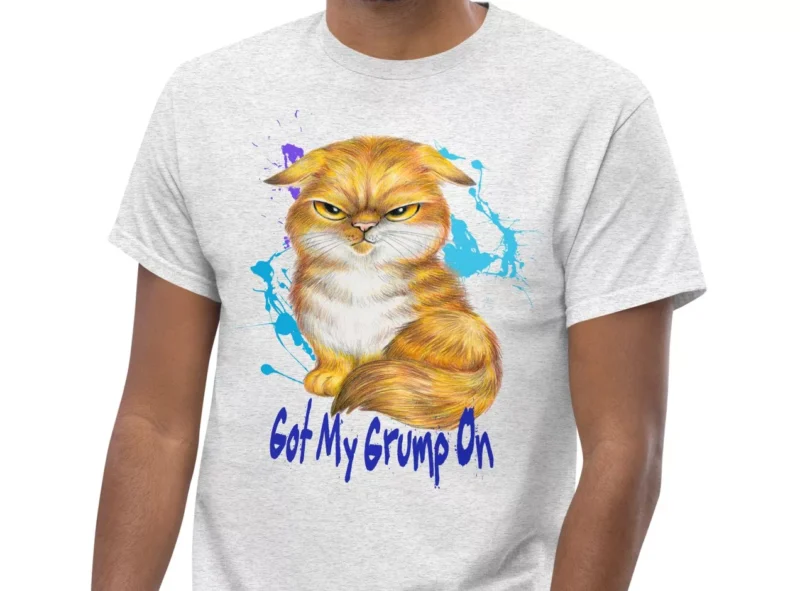 Ash Gray t-shirt showing a Orange Tabby Scottish Fold cat with a grumpy expression.