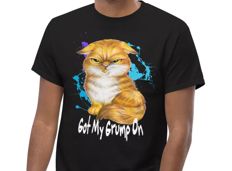 Black t-shirt showing a Orange Tabby Scottish Fold cat with a grumpy expression.